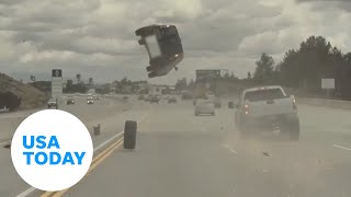 Car flips after being hit by a loose tire on a Los Angeles freeway  USA TODAY [upl. by Ankeny501]