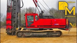 PILE DRIVER MACHINE WITH IMPACT HAMMER ERECTING CONCRETE FOUNDATIONS [upl. by Edwards506]