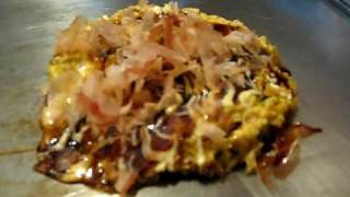 Moving bonito flakes on okonomiyaki [upl. by Meelak65]