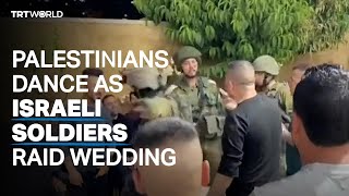 Palestinians dance as Israeli soldiers raid wedding [upl. by Howlyn413]