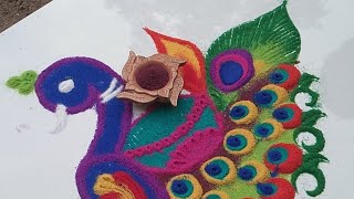 beautiful diya rangoli with peacock 🦚🦚 peacock rangoli design for diwali [upl. by Eradis330]