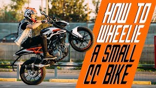 How to wheelie a small cc bike  RokON VLOG 25 [upl. by Fiester]