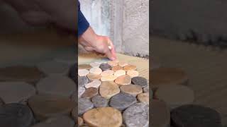 Installing a pebble shower floor diy tiling howto tile construction riverrock pebbles [upl. by Noelopan]