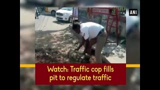 Watch Traffic cop fills pit to regulate traffic  Tamil Nadu News [upl. by Adnahsam247]