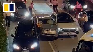 Driver tries to smash past Hong Kong roadblock in viral video [upl. by Peck308]