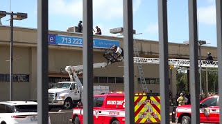 Houston Firefighters Rescue Sign Installer off Bucket Truck [upl. by Amek154]