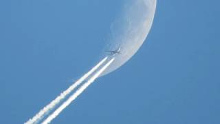 Airbus A320 contrails against the Moon background [upl. by Grindlay]