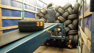 Telescopic conveyor unloading tires and cartons  LOADmaster [upl. by Nate]