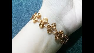 Egyptian Coil Bracelet  How to make wire jewelry 216 [upl. by Atteroc]