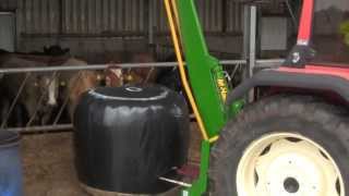 Feeding silage with Same Explorer amp McHale 994 Round Bale Splitter 2013 [upl. by Ahsimal324]