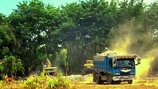 Caterpillar 318C Excavator Loading Trucks in the farm [upl. by Ycats322]