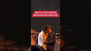 MattyHealy of The1975 kisses another fan onstage during a performance 😳 shorts  MUCHMUSIC [upl. by Tlihcox]