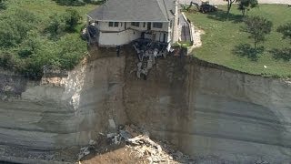 Couple looks on as house falls off cliff [upl. by Farrar]