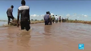 Mozambique On foot cyclone Idai survivors flee stormstruck region [upl. by Akitan]