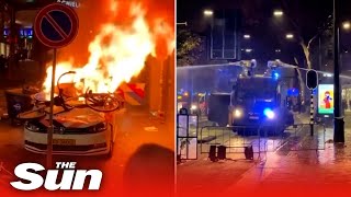 Seven injured in anti lockdown riots in the Netherlands as cops open fire on violent protest [upl. by Tanny]