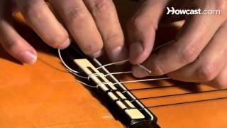 How to Restring a Nylon String Guitar  Guitar Lessons [upl. by Rai]