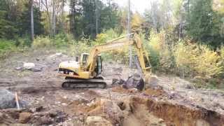 Grubbing out a Hole with a Cat 312 [upl. by Barcus]