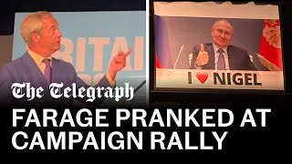 Nigel Farage pranked with Putin banner during speech [upl. by Enajharas552]