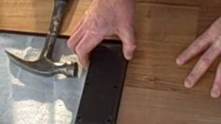 How to Install Laminate Flooring Part 1  Tapping Block [upl. by Allemaj]