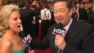 Mickey Rourke checks out Jessica Holmes on the red carpet [upl. by Kletter]