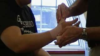 How To Wrap An Elastic Bandage Thumb Sprain [upl. by Wandis]