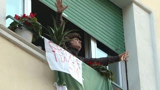 Coronavirus Italians sing under lockdown  AFP [upl. by Legnaleugim]