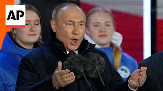 Putin attends concert in Moscow on Crimeas annexation anniversary [upl. by Airyt780]