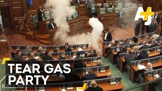 Tear Gas And Egg Throwing On Kosovos Parliament Floor [upl. by Learsi]