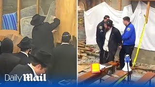 Hasidic jews find secret tunnel at New York synagogue and brawl with police as they try to close it [upl. by Llerdnad]