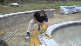 Laying pavers around pool coping [upl. by Marion]