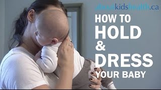 How to hold and dress your newborn baby [upl. by Narrat]